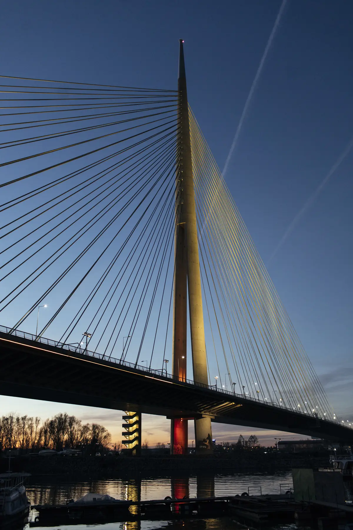 The pylon and cables of Most na Adi against a blue sky