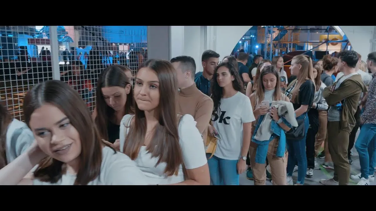 A queue of visitors filing into the Sneakerville hall, still frame from the festival's own recap video